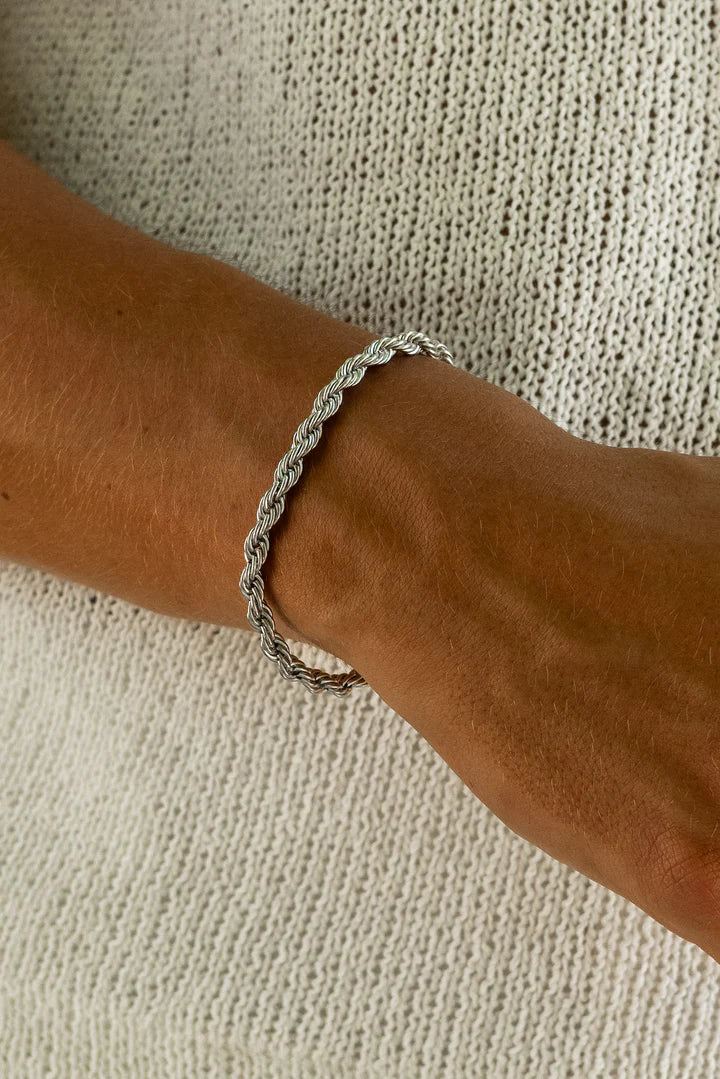 a woman's arm with a bracelet on it