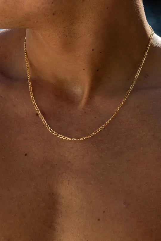 a close up of a person wearing a necklace