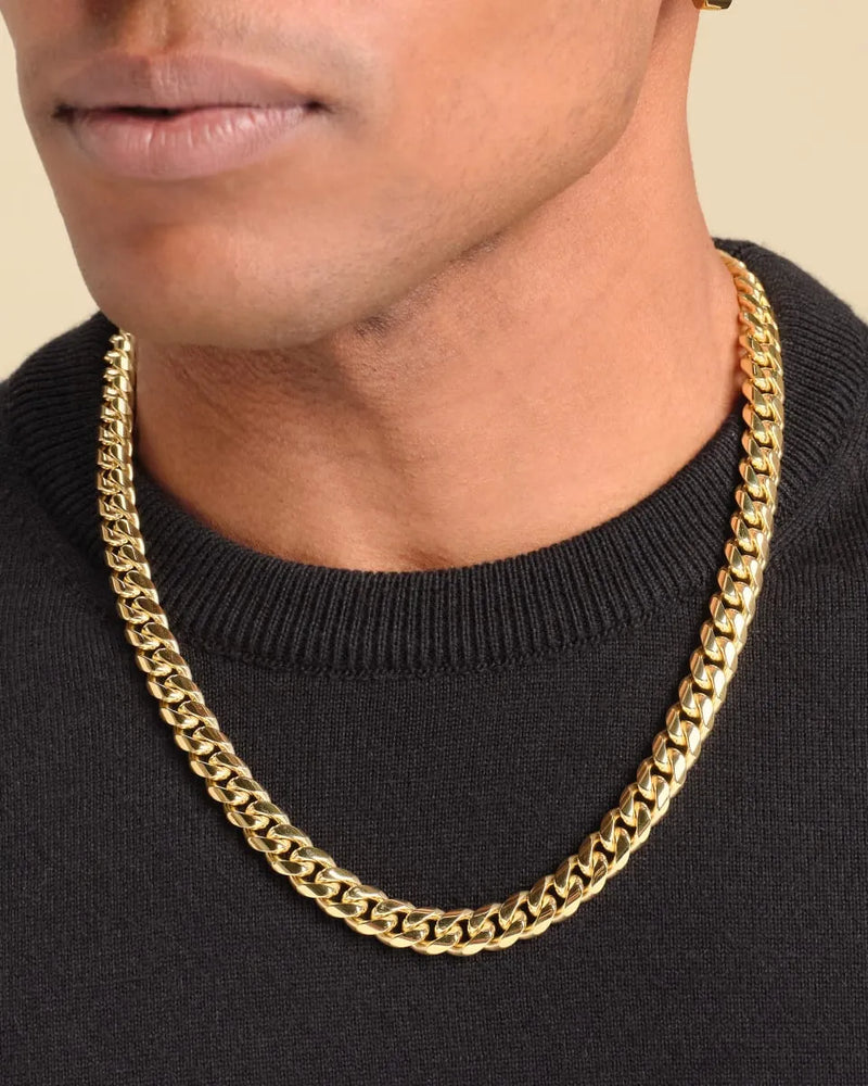 a man wearing a gold chain necklace