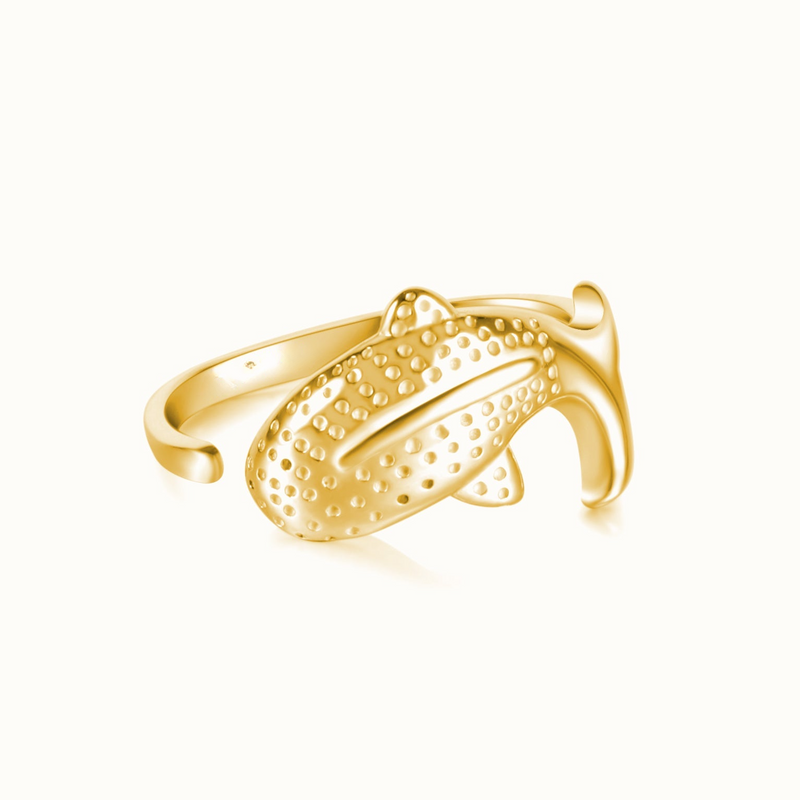 a yellow gold ring with perfored details