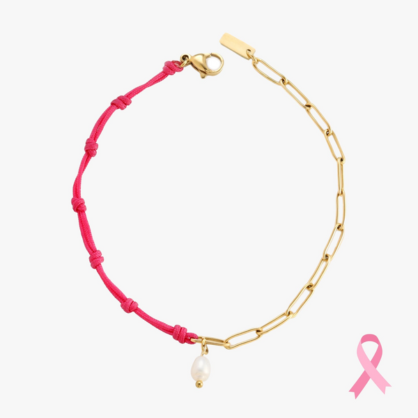 a bracelet with a pink ribbon and a pearl charm