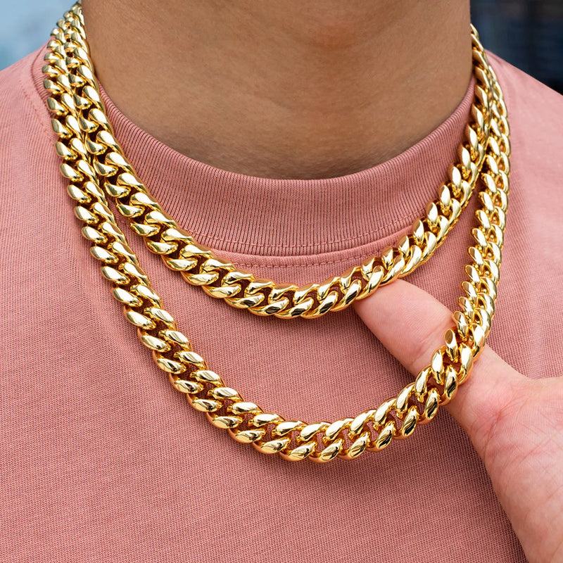 a close up of a person wearing a gold necklace