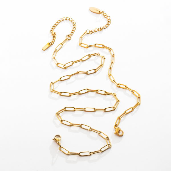 a gold chain is shown on a white surface