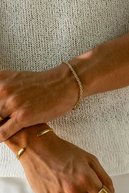 a close up of a person wearing a bracelet