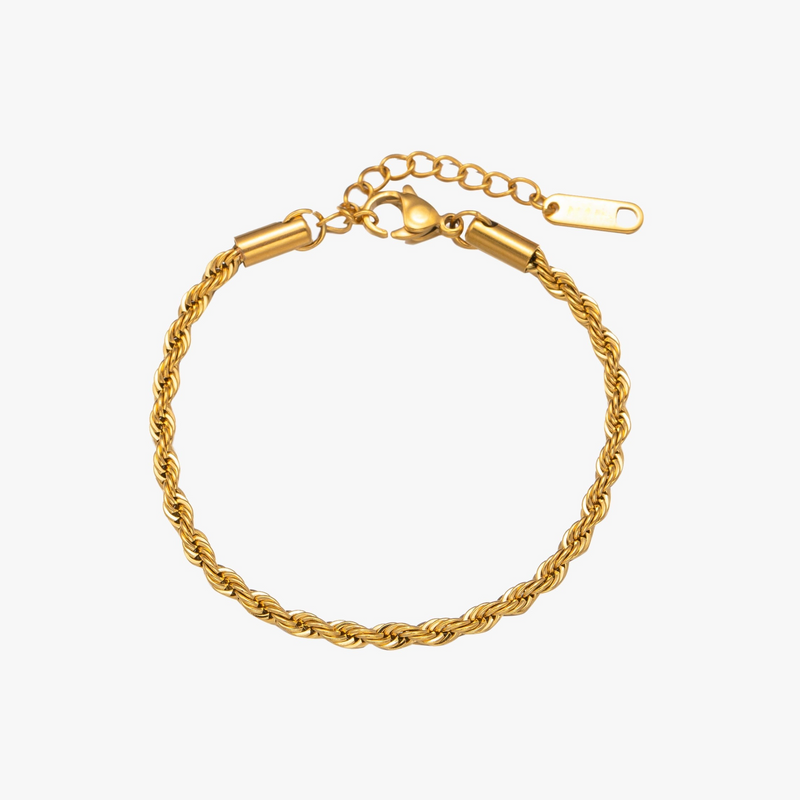 a gold bracelet with a clasp on a white background