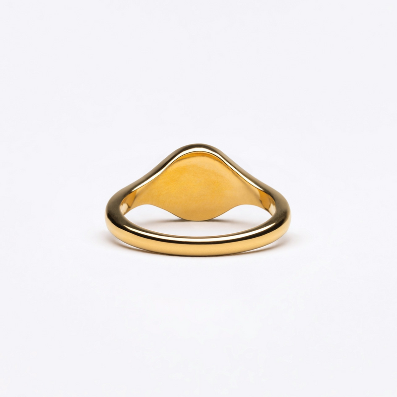 a gold ring on a white background