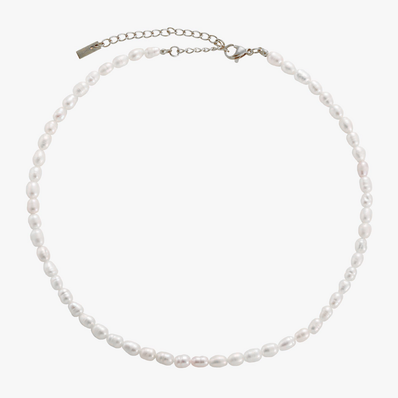 a white pearl necklace with a silver clasp