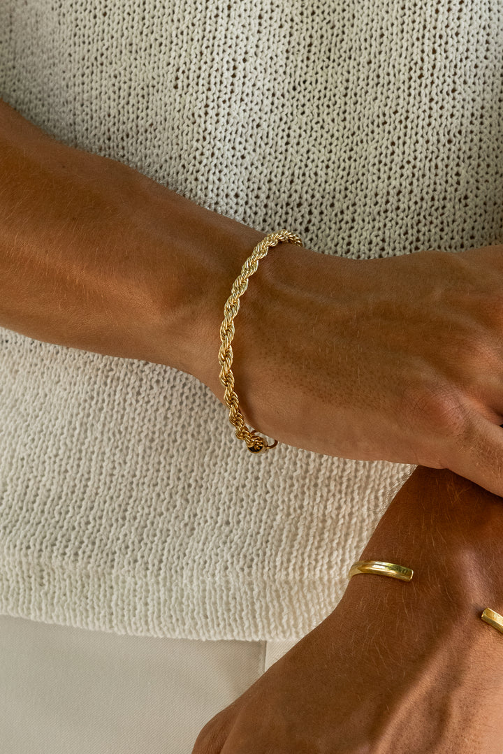 a close up of a person wearing a bracelet