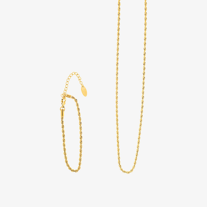 a pair of gold chain earrings on a white background