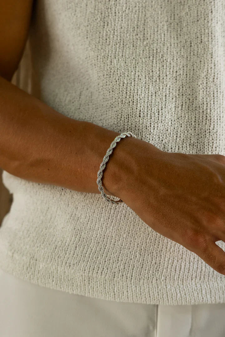 a close up of a person wearing a bracelet