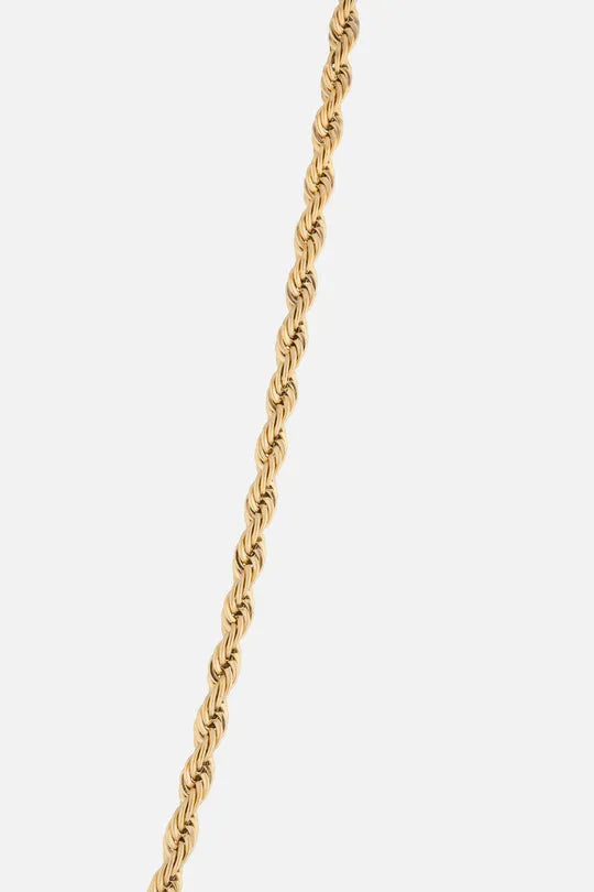 a gold chain on a white background