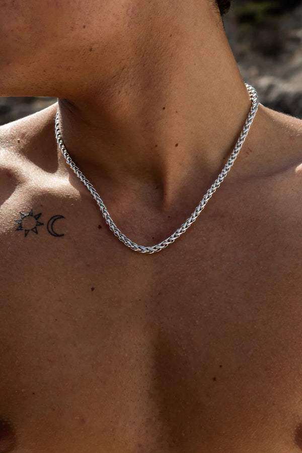 a man with a tattoo on his chest