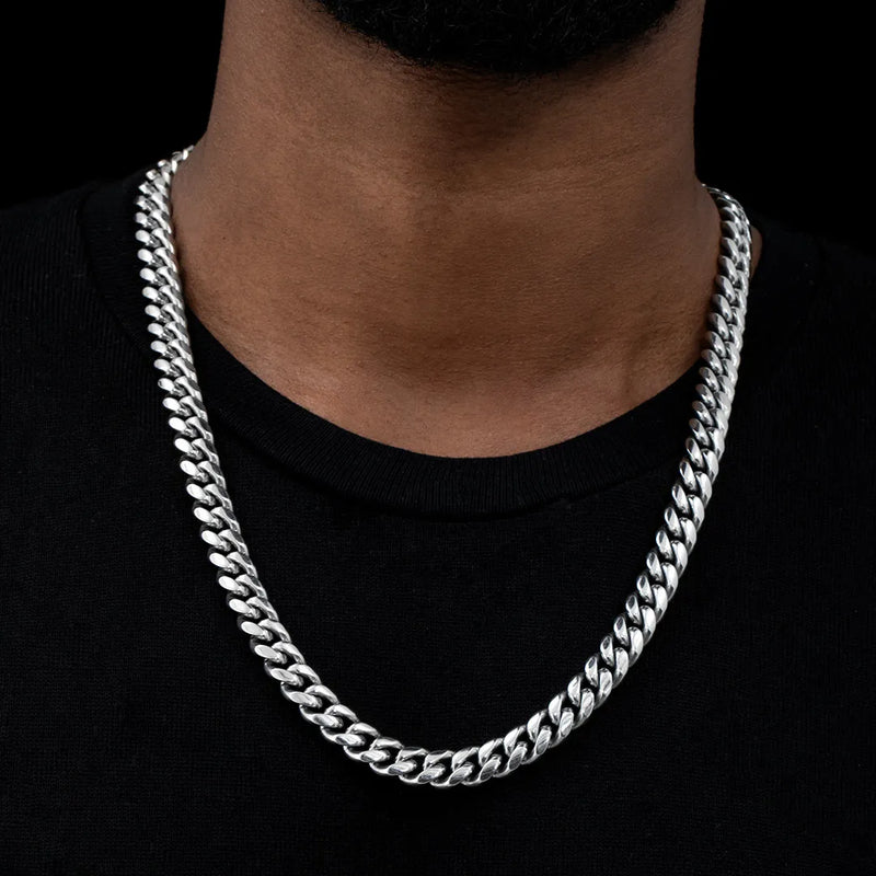 a man wearing a silver chain necklace