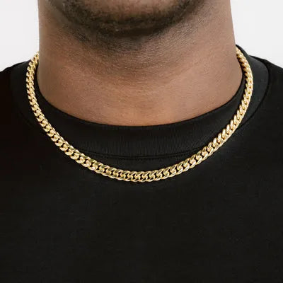 a man wearing a gold chain necklace