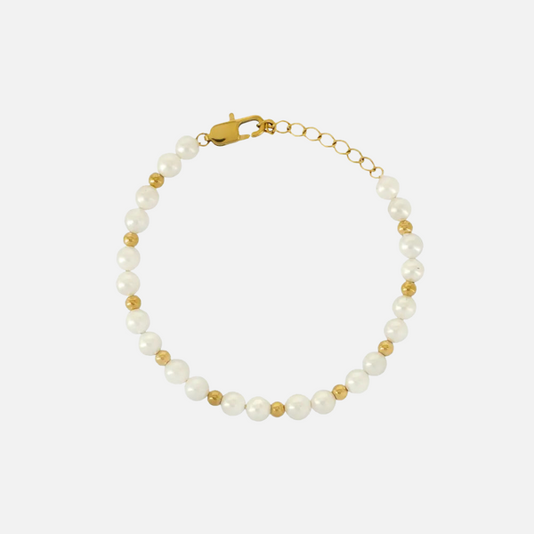 a bracelet with pearls and gold beads