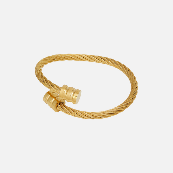 a close up of a gold ring on a white background