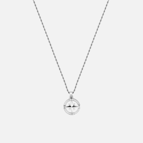 a silver necklace with a circular pendant on a chain