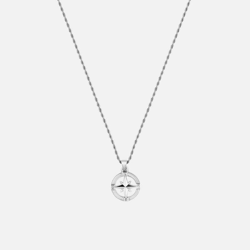 a silver necklace with a circular pendant on a chain