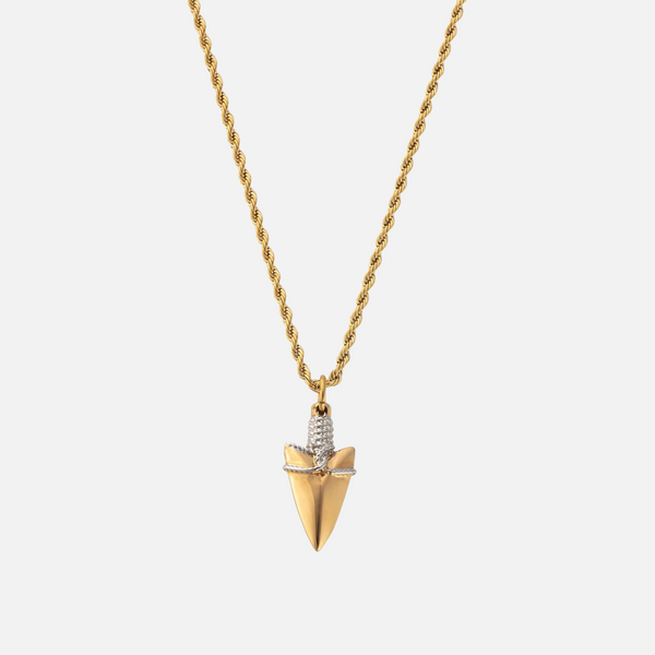 a gold necklace with a pendant with a diamond on it