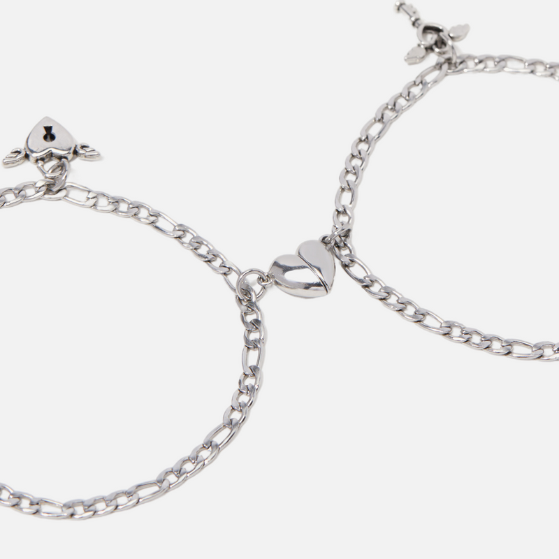 a pair of silver hoop earrings on a white background