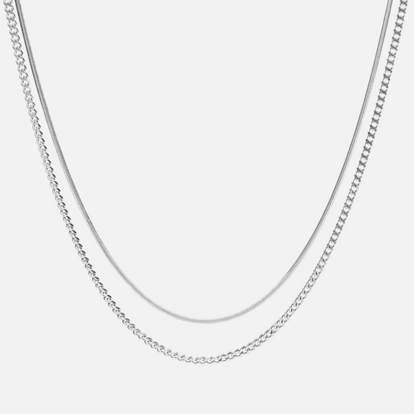 a silver chain is shown on a white background