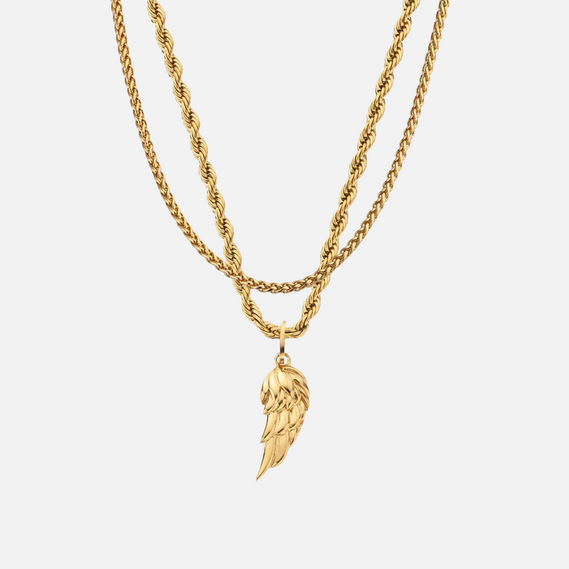 a gold necklace with an angel wing on it