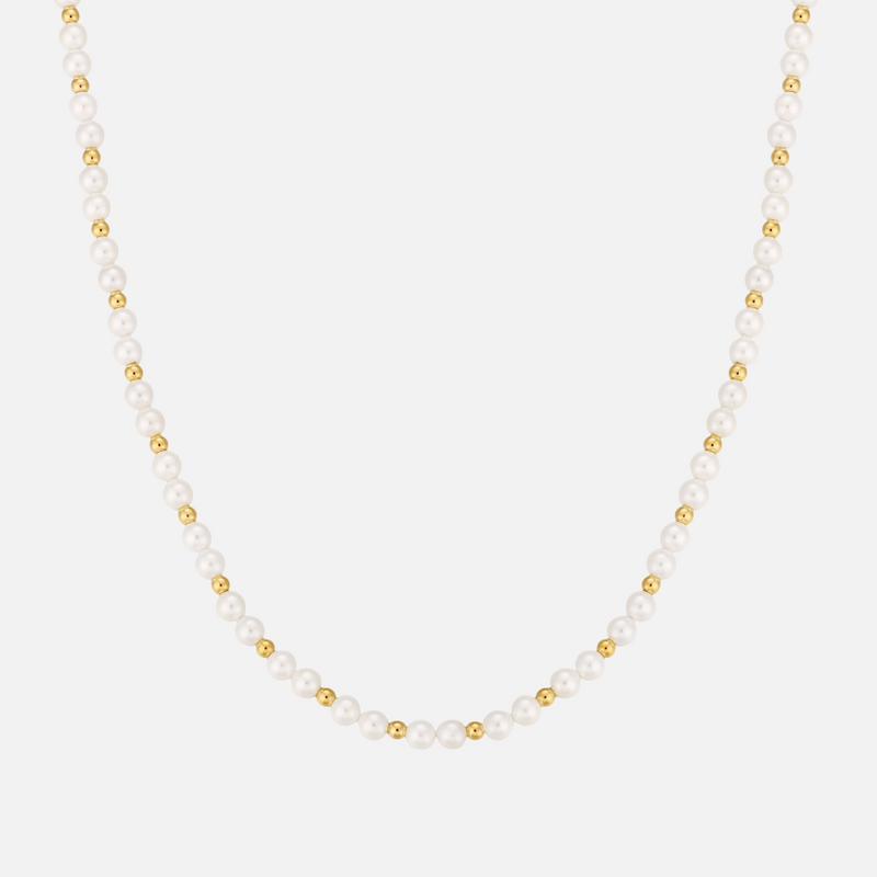 a necklace with pearls and gold beads